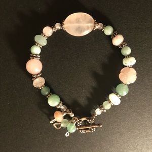 A very sweet bracelet of pretty colored beads.,